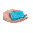 Bright blue Shots Soap Bar ’After Sex Soap’ held in hand - perfect for a refreshing cleanse