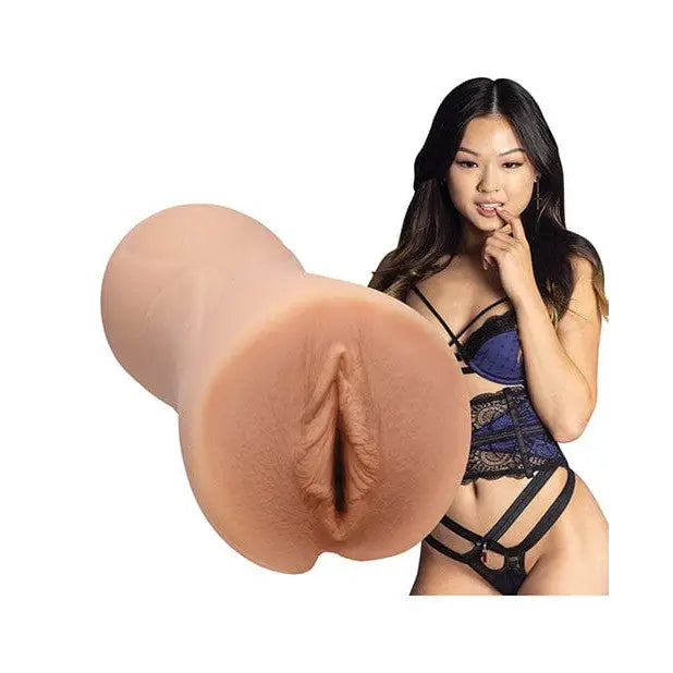 A woman in lingerie holding a Signature Strokers Lulu Chu ULTRASKYN Pocket Pussy