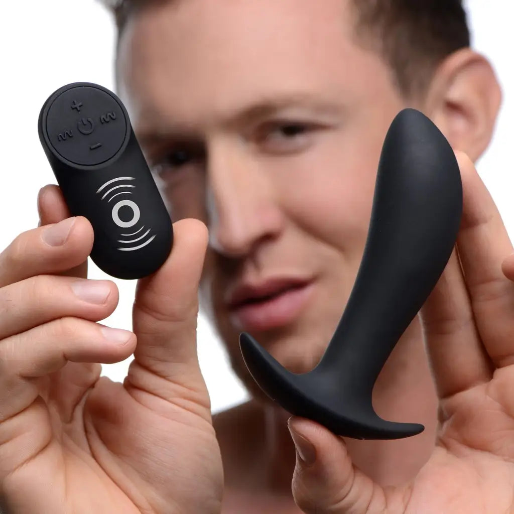 Man holding a black remote control for Silicone Prostate Vibrator With Remote Control