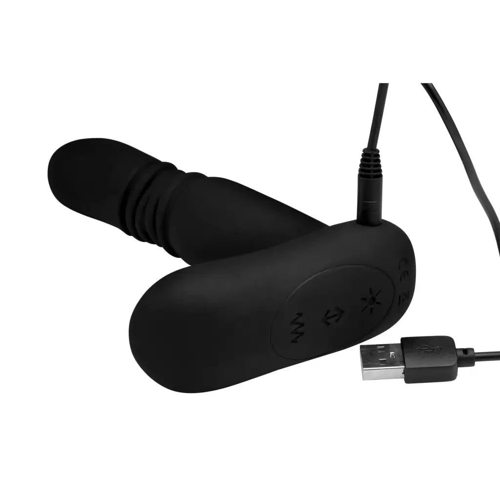 Black silicone thrusting anal plug with USB charging cable and remote control