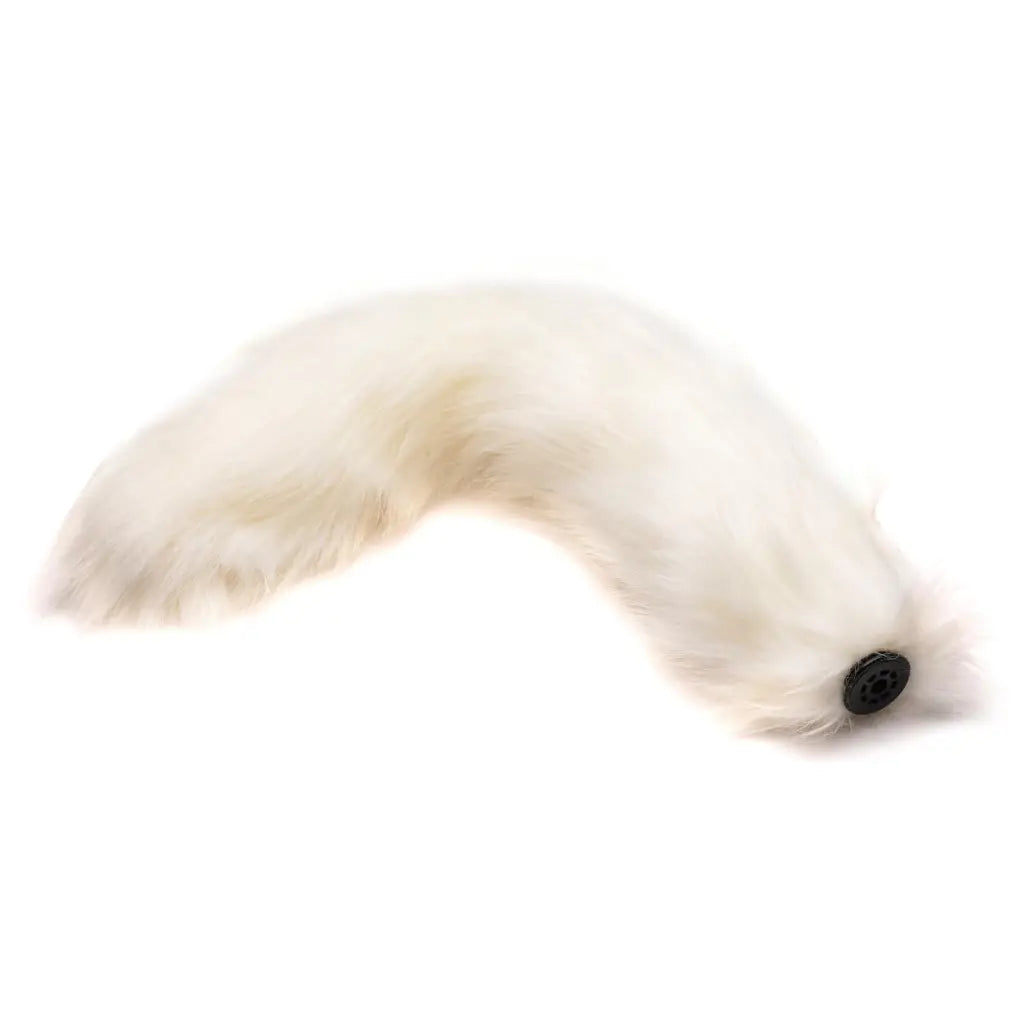 Small anal plug with interchangeable fluffy white fox tail and visible black eye