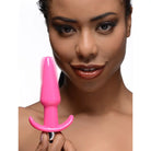 Bright pink smooth vibrating anal plug designed for enhanced pleasure and comfort