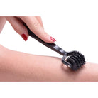 Spiked 5 Row Pinwheel tool used for microneedling on skin: effective derma roller