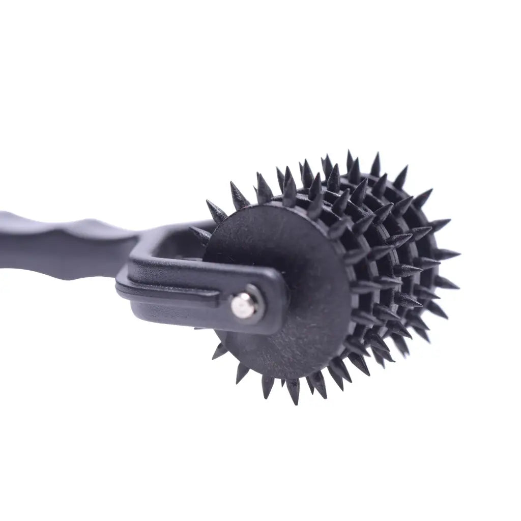 Spiked 5 Row Pinwheel - Spiked roller tool with a black handle for precise applications