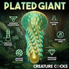 Elongated silicone sex toy with suction cup base, resembling a spiky reptilian creature