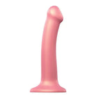 Close-up of a pink Strap On Me flexible dildo on a white background