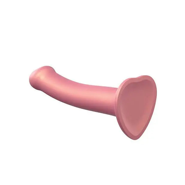 Pink flexible dildo from Strap On Me against a white background