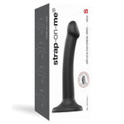 Black remote vibrating device in Strap-On-Me Silicone Bendable Dildo packaging