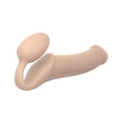 A pair of fleshes showcasing Strap-On-Me Strapless Silicone Non-Vibrating Strap on