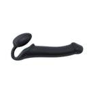 A black plastic cat tail attached to a Strap-On-Me Strapless Silicone Non-Vibrating Strap on