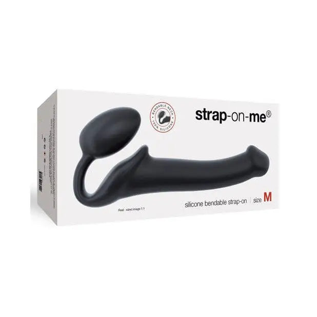 A black vibrating strap device with a black handle in a white box