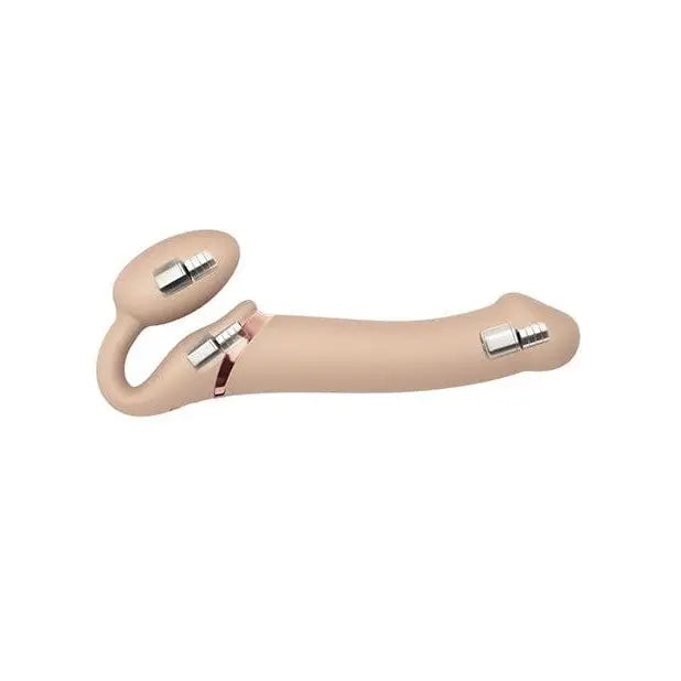 Close up of a person holding vibrating rechargeable strapless strap and remote