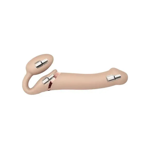 Close-up of a hand holding the Strap-On-Me vibrating rechargeable strapless strap-on