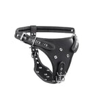 A black leather double penetration strap on harness with metal hardware by Strict