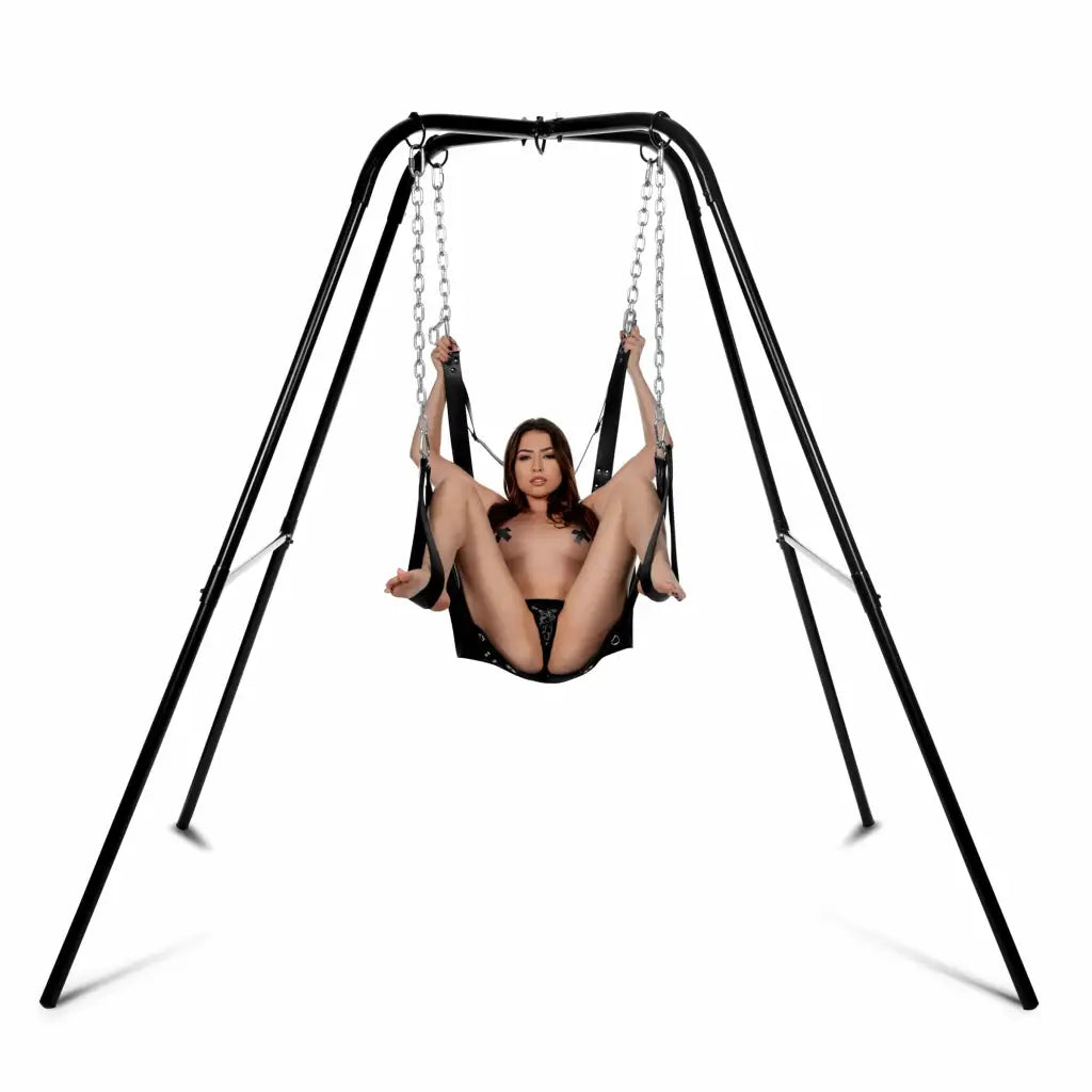 A woman enjoying the STRICT Extreme Sling on a sturdy swing stand