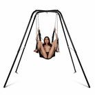 A woman enjoying the STRICT Extreme Sling on a sturdy swing stand