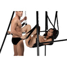 Couple in black underwear tied to pole on a STRICT Extreme Sling and Swing Stand