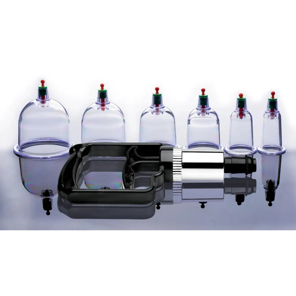 Sukshen 6 Piece Cupping Set With Acu-points next to a bottle filling machine with four bottles