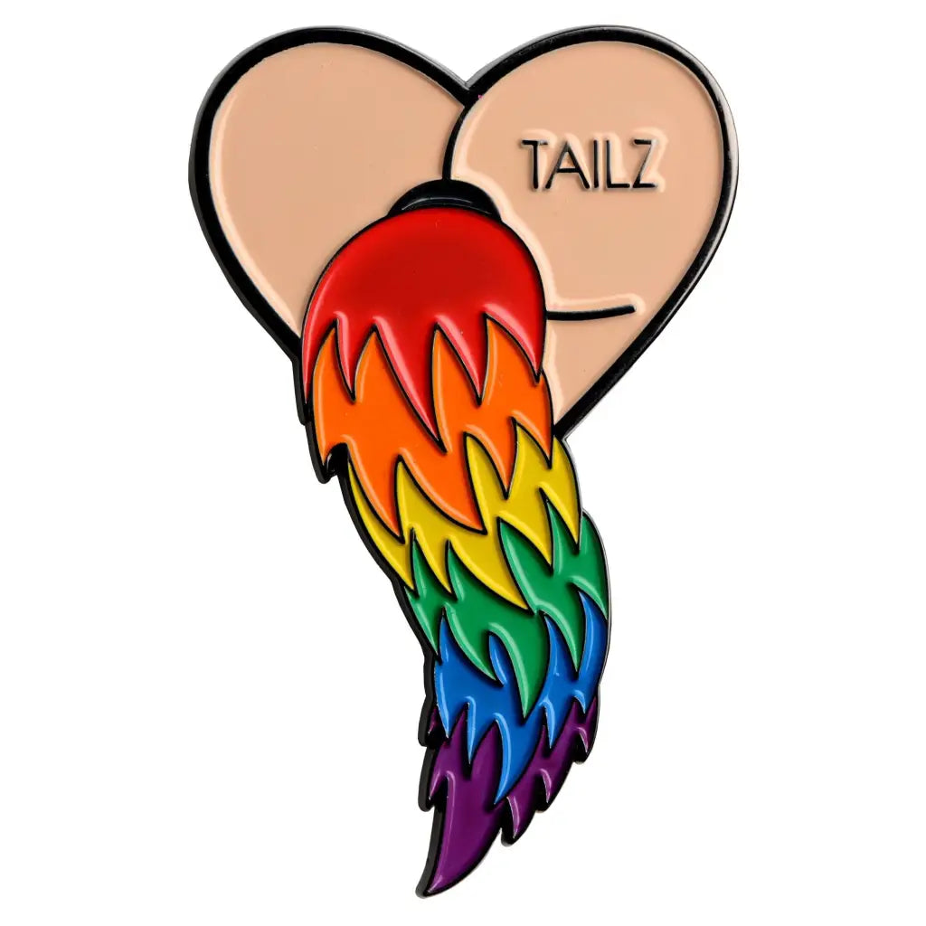 Heart-shaped Tailz Enamel Pin with rainbow tail emerging from ’TAILZ’ text