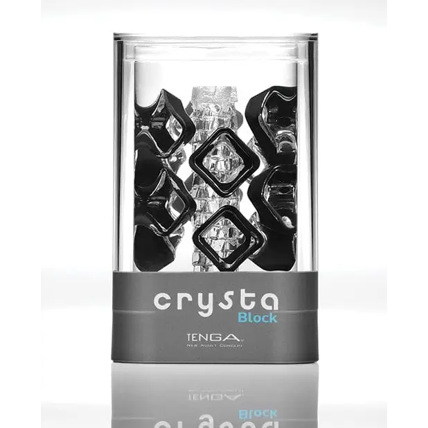 Clear plastic container with Tenga Crysta Block holding black and clear geometric ice cubes