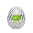 Egg-shaped Tenga EGG Brush with green label reading ’Easy Beat EGG Brush’ by Tenga