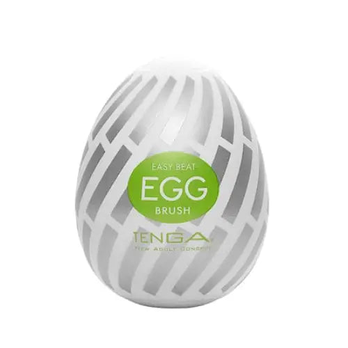 Egg-shaped Tenga EGG Brush with green label reading ’Easy Beat EGG Brush’ by Tenga