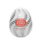 Tenga EGG Tornado - Egg-shaped white device with spiral design and red label for pleasure