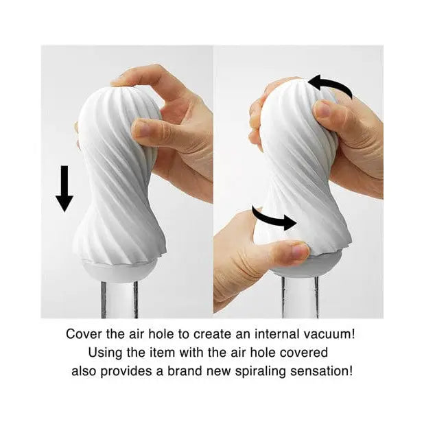 Hand holding TENGA FLEX Spiraling Reusable Sleeve with arrow indicating use