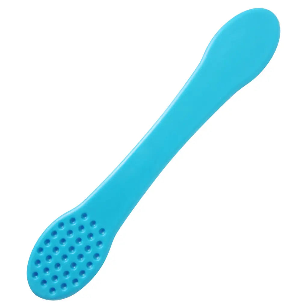 Textured Blue Silicone CBT Ball Slapper with a blue toothbrush and tooth brush