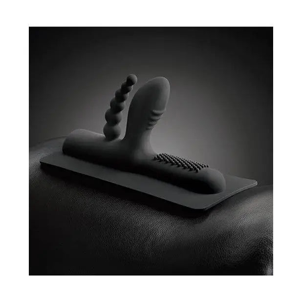 Black and white photo of a foot with The Cowgirl Buckwild double penetration silicone attachment