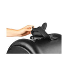 Hand holding a black leather seat of The Cowgirl Premium Sex Machine