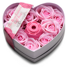 Heart-shaped box filled with pink roses, featuring a magnetic charging base