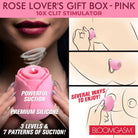 A woman holding The Rose Lovers Gift Box with pink rose device and magnetic charging base