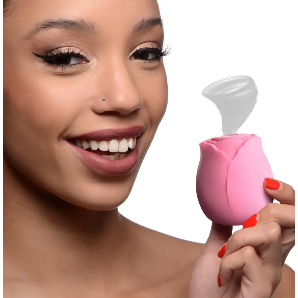 Woman holding pink lip brush from The Rose Lovers Gift Box 10x Clit Suction Rose with magnetic charging