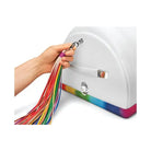 A hand holding a rainbow colored cable for The Unicorn Premium Sex Machine