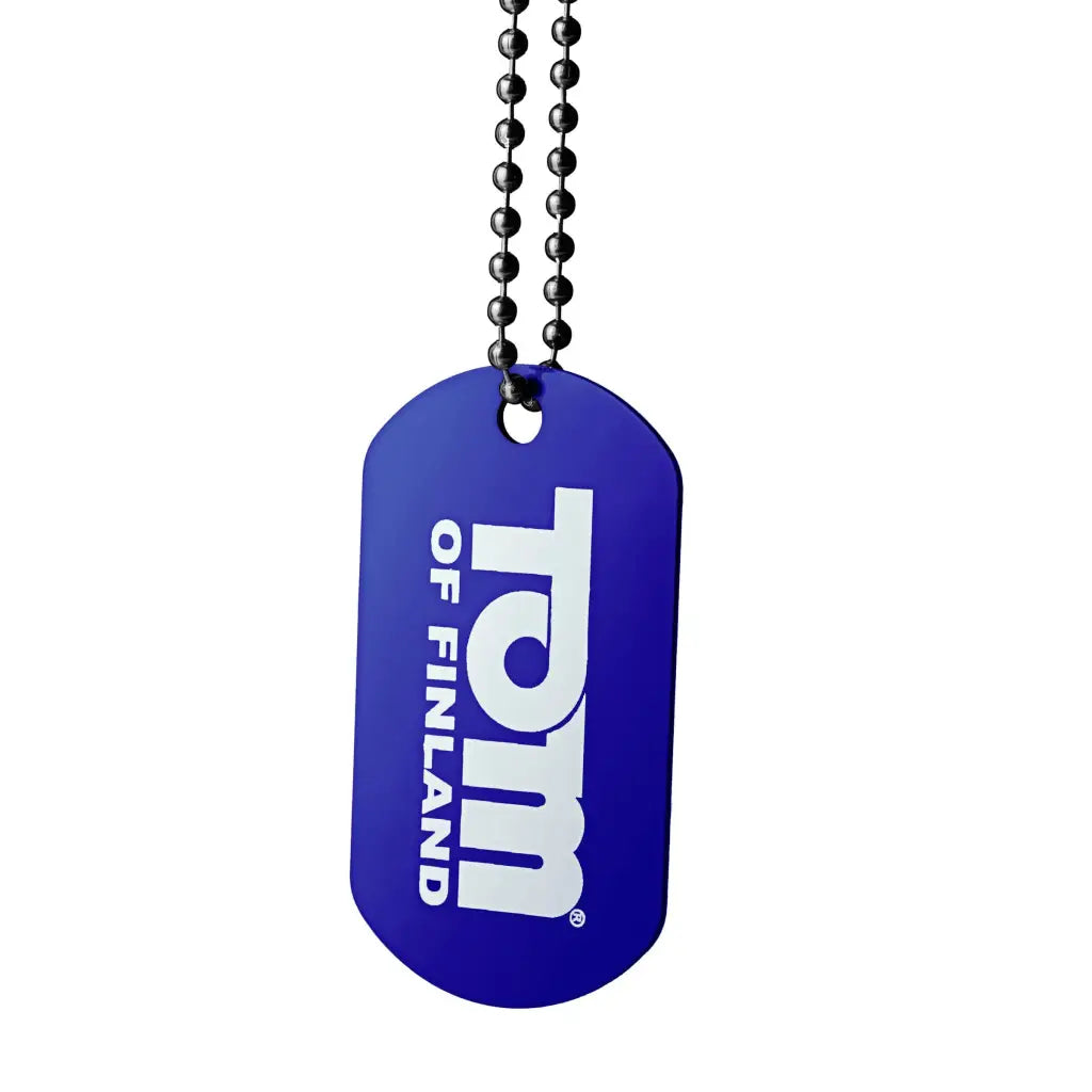 Blue dog tag with ’rdm OF FINLAND’ on a ball chain, advertising Tom Of Finland Water Based Lube