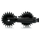 Transfix 10 Reel Dual Pinwheel: Spiked roller device with two circular wheels and handle