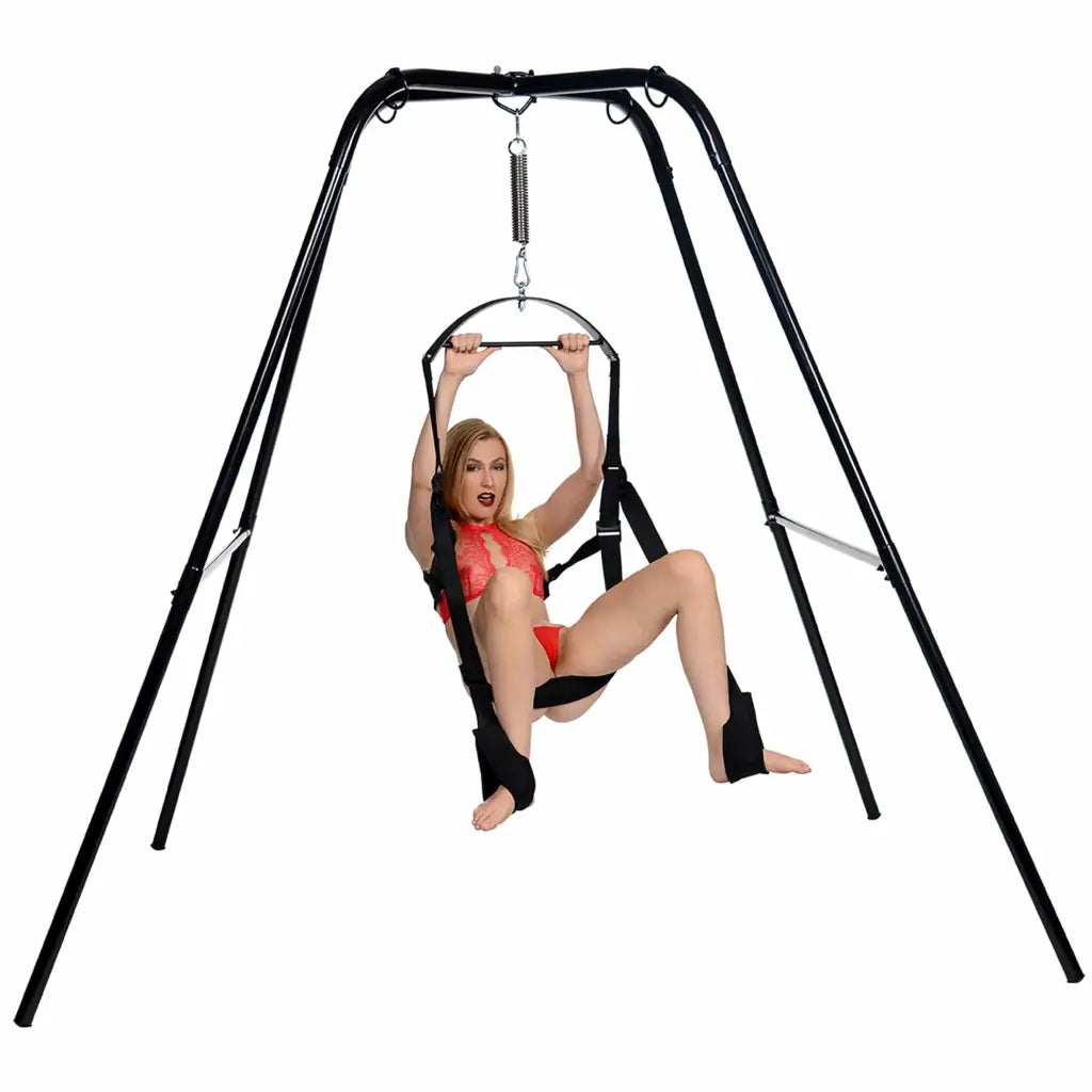 Woman in a red bikini top enjoying the Trinity Vibes Ultimate Sex Swing Stand