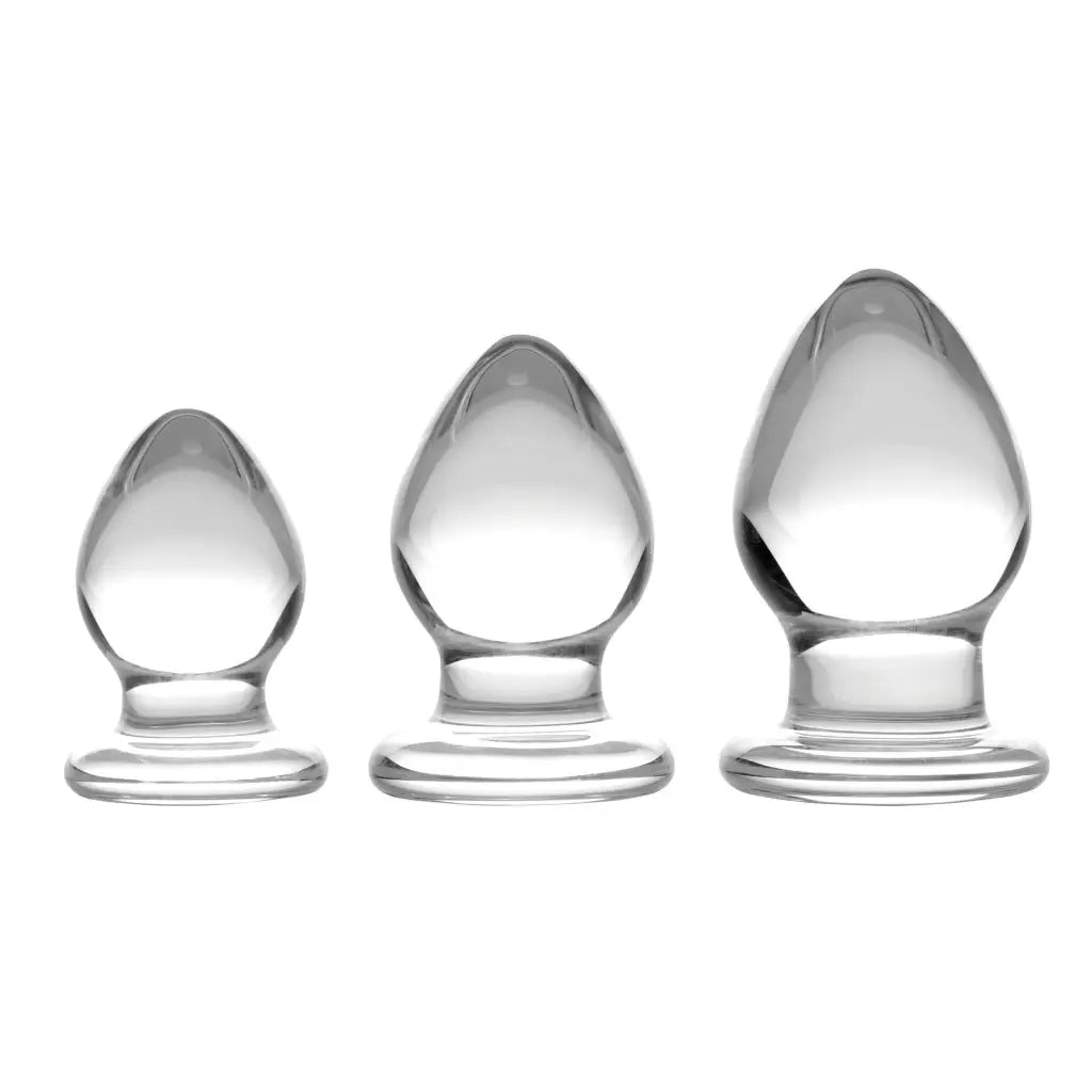 Triplets 3 Piece Glass Anal Plug Kit: Three glass candles on a white background