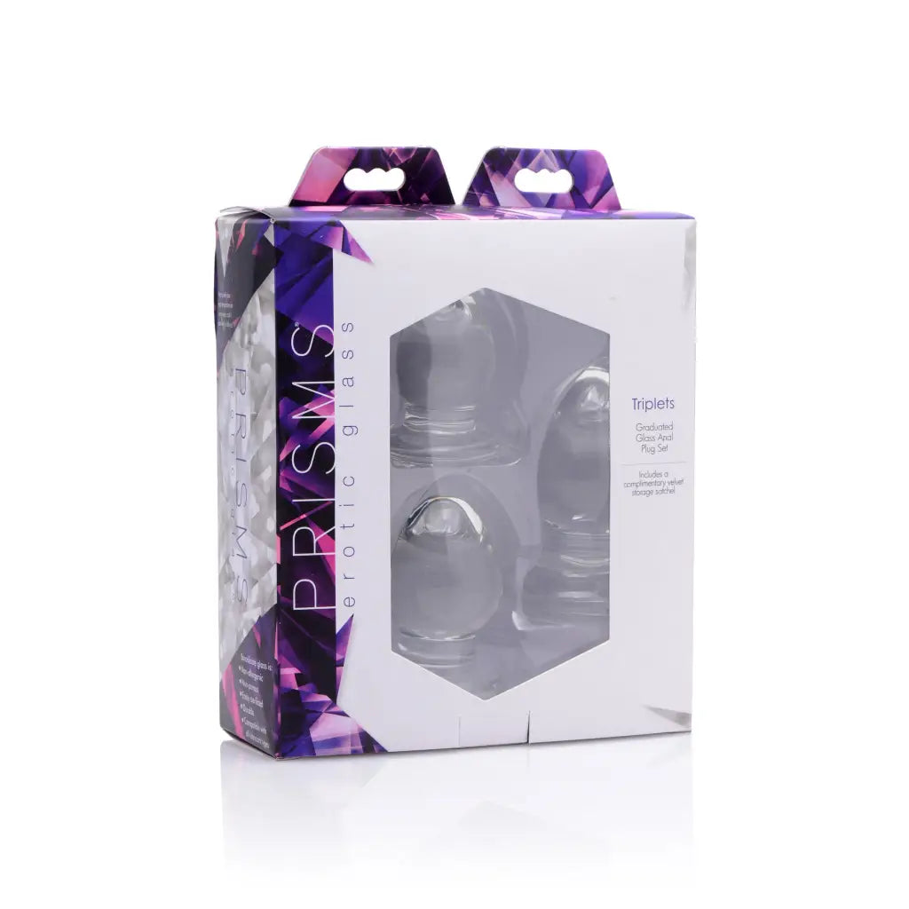 The box for the new Triplets 3 Piece Glass Anal Plug Kit displayed on a sleek surface