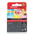 Close-up of toothbrush packaging on white surface with Trojan Nirvana featuring original artwork