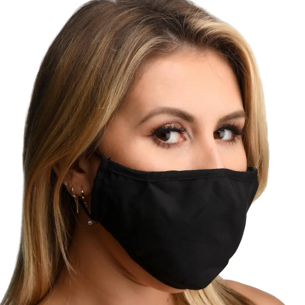 Person with blonde hair wearing Under Cover Ball Gag Face Mask featuring rubber ball gag