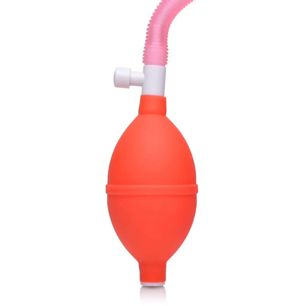 Vaginal pump with a red rubber bulb and pink flexible tube for enhanced pleasure