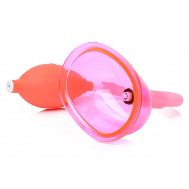 Vaginal pump with pink silicone menstrual cup and orange stem for eco-friendly period care