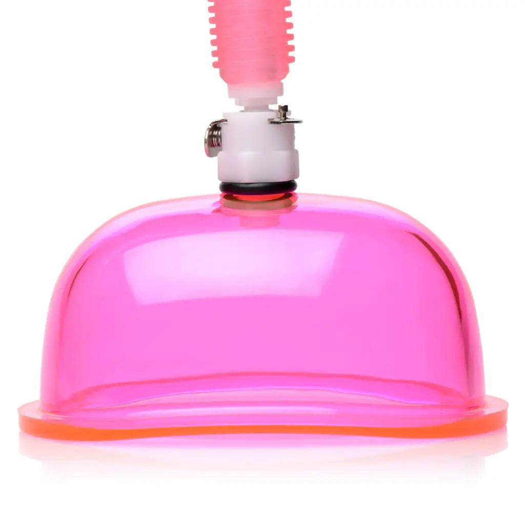 Vaginal pump with pink breast pump suction cup and attached tubing for intimate care