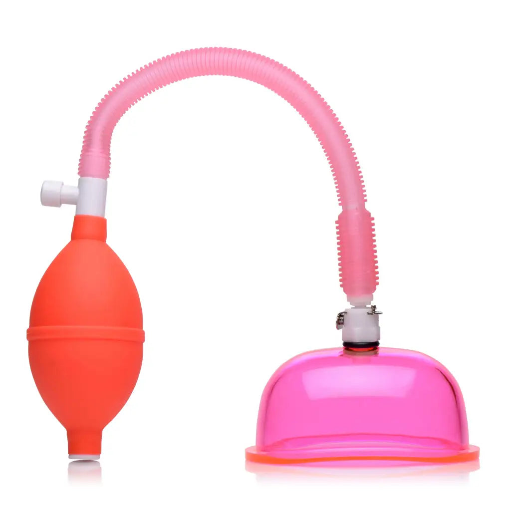 Vaginal Pump with pink tubing, red squeeze bulb, and pink suction cup for women’s health