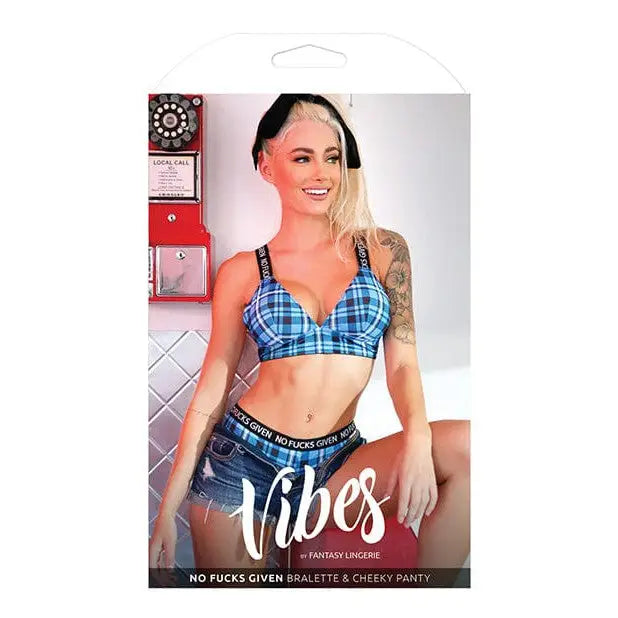 Lingerie advertisement featuring woman in blue plaid bralette & cheeky panty by Vibes ’No Fuck’