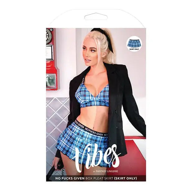 Blonde woman in plaid box pleat skirt and bra top with black blazer in lingerie ad