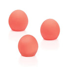 Three pink We-Vibe Bloom Coral replacement balls on a white background