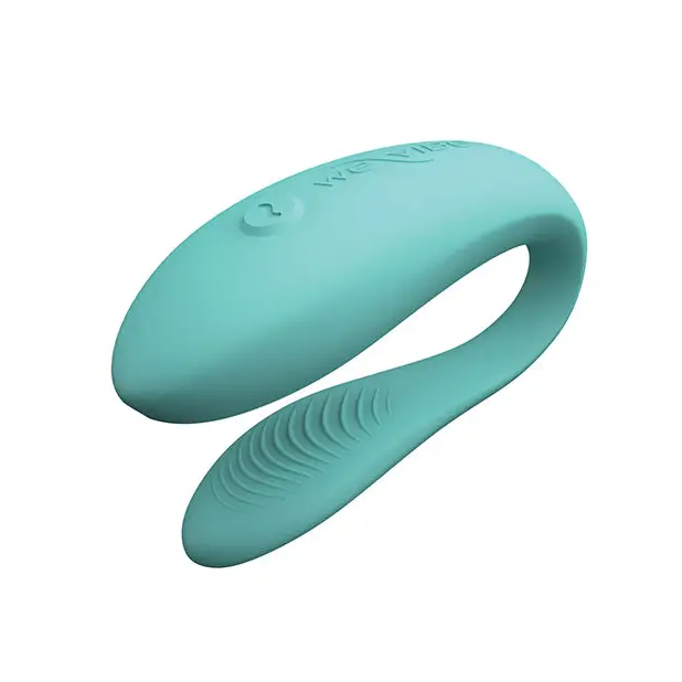 Close-up of We-Vibe Sync Lite blue plastic object with curved handle and single button